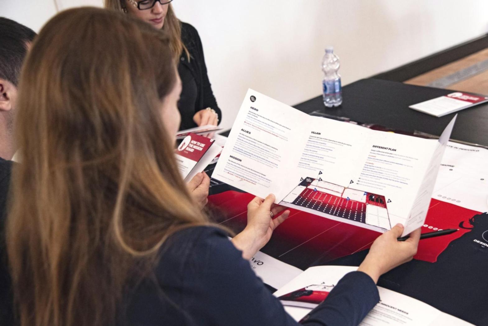 Professional workspace showing financial analysis tools and business planning materials